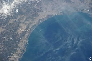 Through a thin haze of clouds, flooding was still discernible south of Sendai days after the massive 9.0-magnitude earthquake and resulting tsunami that struck on March 11, 2011. An Expedition 26 crew member took this photograph on March 14 from the International Space Station.