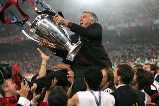 Carlo Ancelotti celebrating with the Champions League trophy