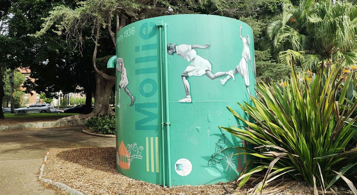 A photo of a green water tank with illustrations