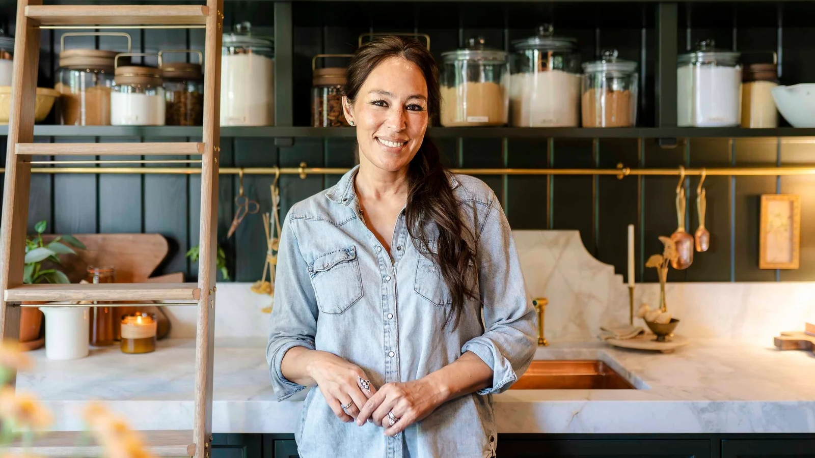Joanna Gaines in her green kitchen