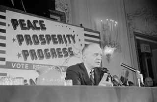 Republican candidate and incumbent President Dwight D. Eisenhower, commonly known as 'Ike', with the slogan 'Peace Prosperity Progress' during the Republican Convention in San Francisco, California, 22nd August 1956.