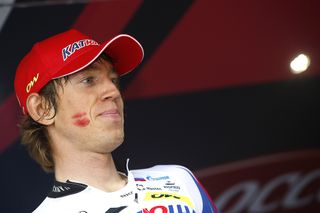 Ilnur Zakarin (Katusha) poses on the podium with lipstick marks on his face after winning the 11th stage of the 98th Giro d'Italia.