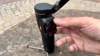 Hohem iSteady V3 gimbal held in a hand