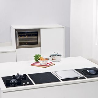 kitchen room with white walls and hobs