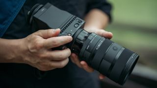 Sigma 28-45mm f/1.8 DG DN lens, mounted to a Sigma fp L camera, being used outdoors by Yuichiro Fujishiro