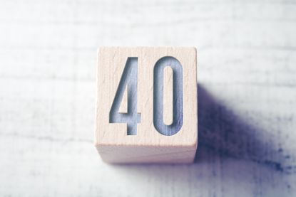 the number 40 carved in a wooden block