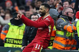 Mohamed Salah points in celebration after scoring for Liverpool against Lille in the Champions League league phase match at Anfield in Liverpool on 21 January, 2025