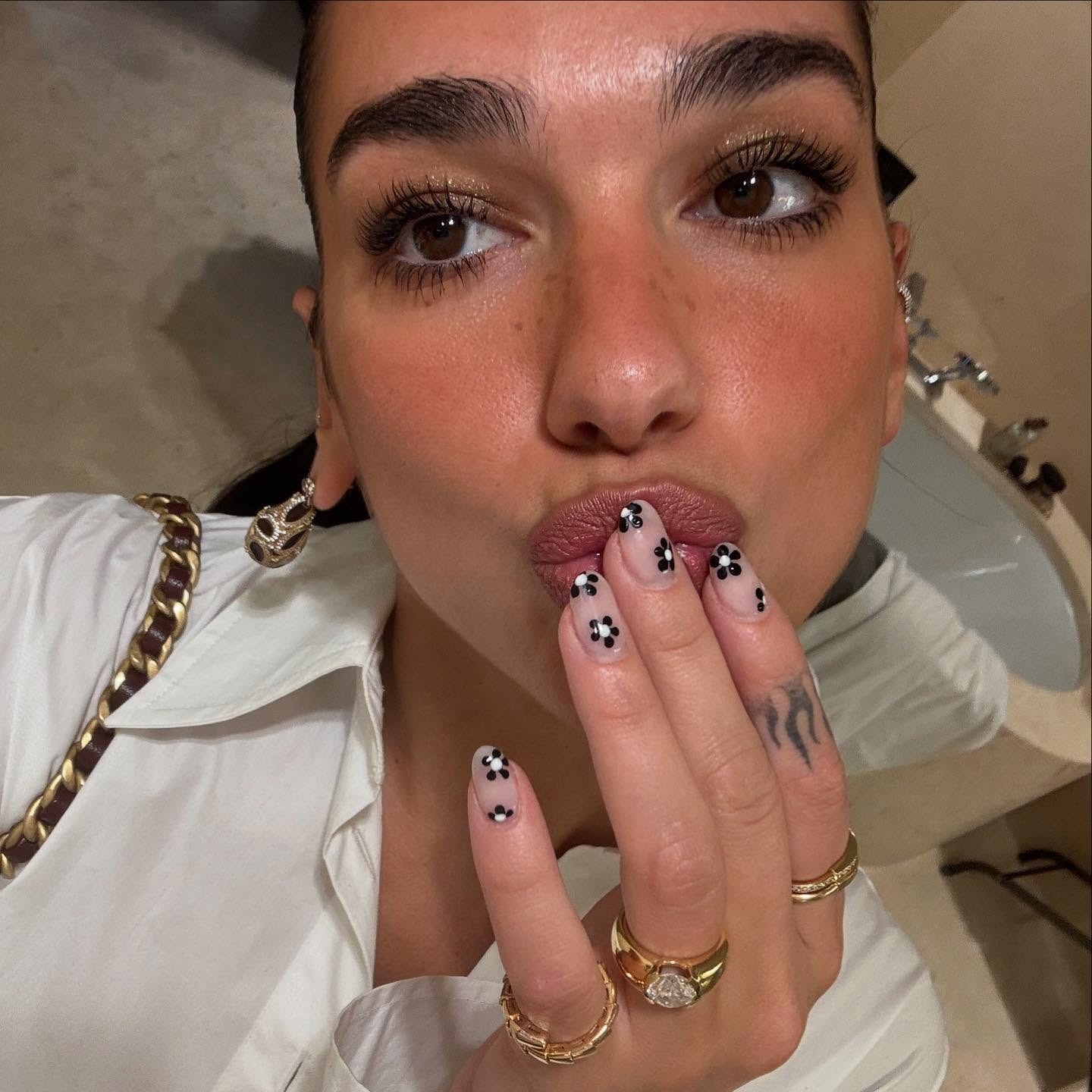 A selfie of Dua Lipa with nails painted by Michelle Humphrey.