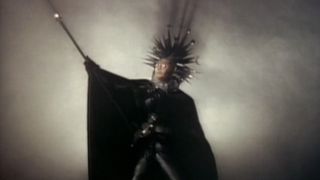 A strange-looking wizard character holding a scepter in music video for Electric Sun's "The Night the Master Comes" on Beavis and Butt-Head