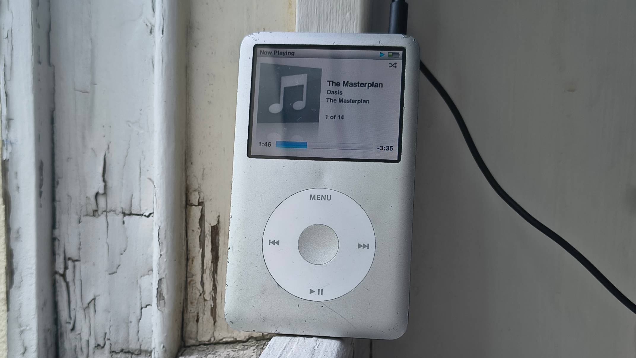 The iPod Classic on a window sill.