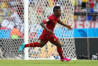 Asamoah Gyan celebrates after scoring for Ghana against Germany at the 2014 World Cup.