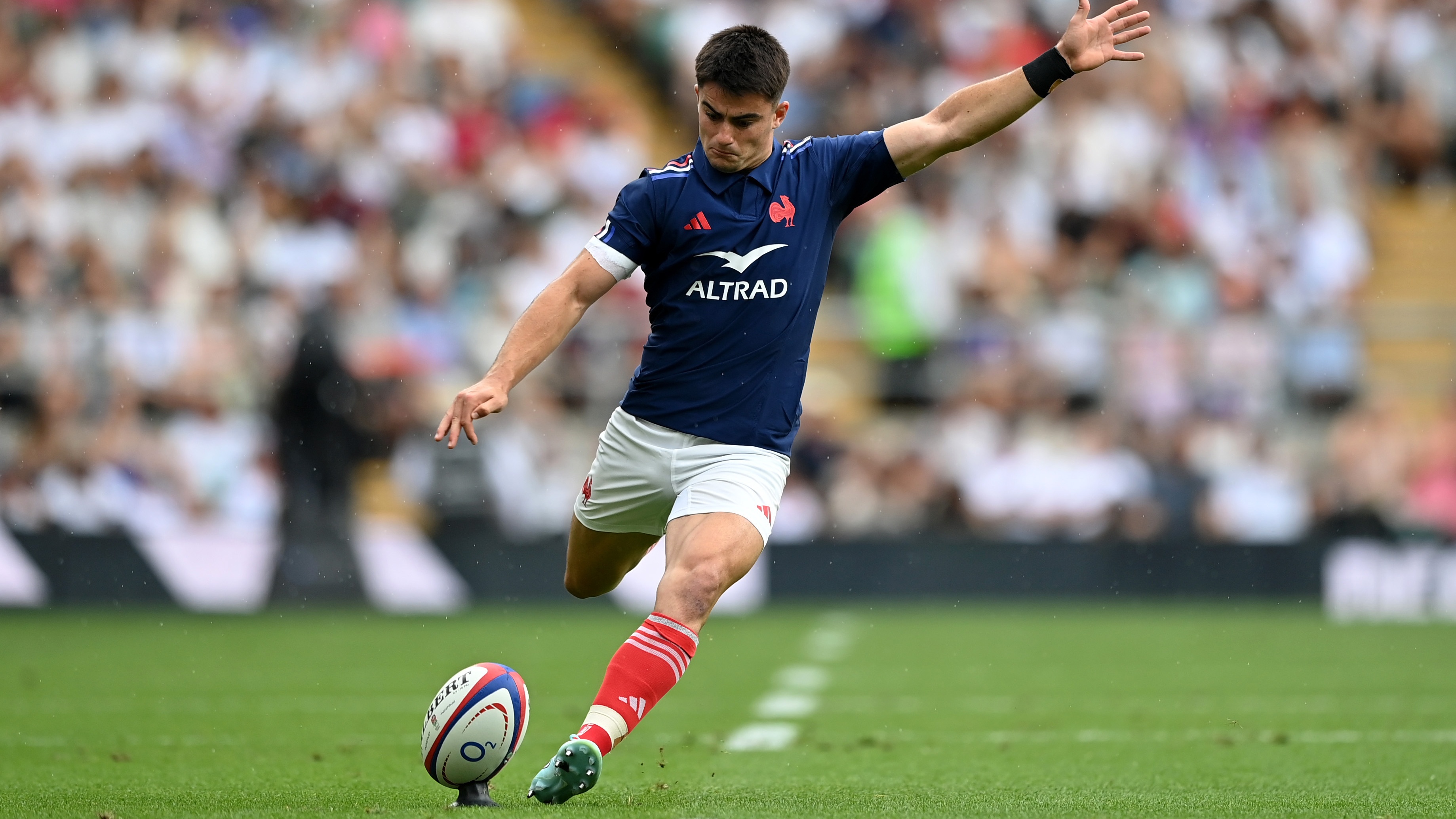 Nolann Le Garrec kicks a conversion off the tee in a match against England Rugby.