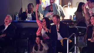 Prince Harry and Meghan Markle watch the Los Angeles Lakers