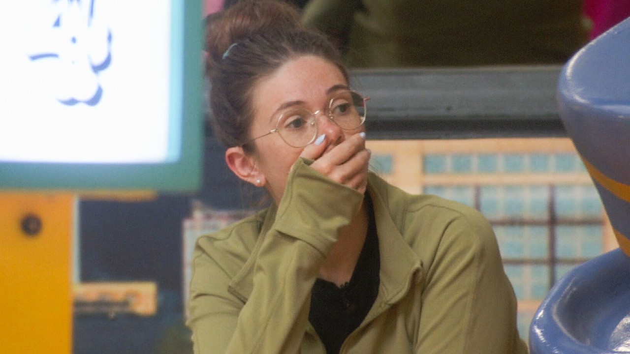 Kelley with her hand over her mouth