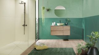 shower room with green wall and wall hung vanity unit