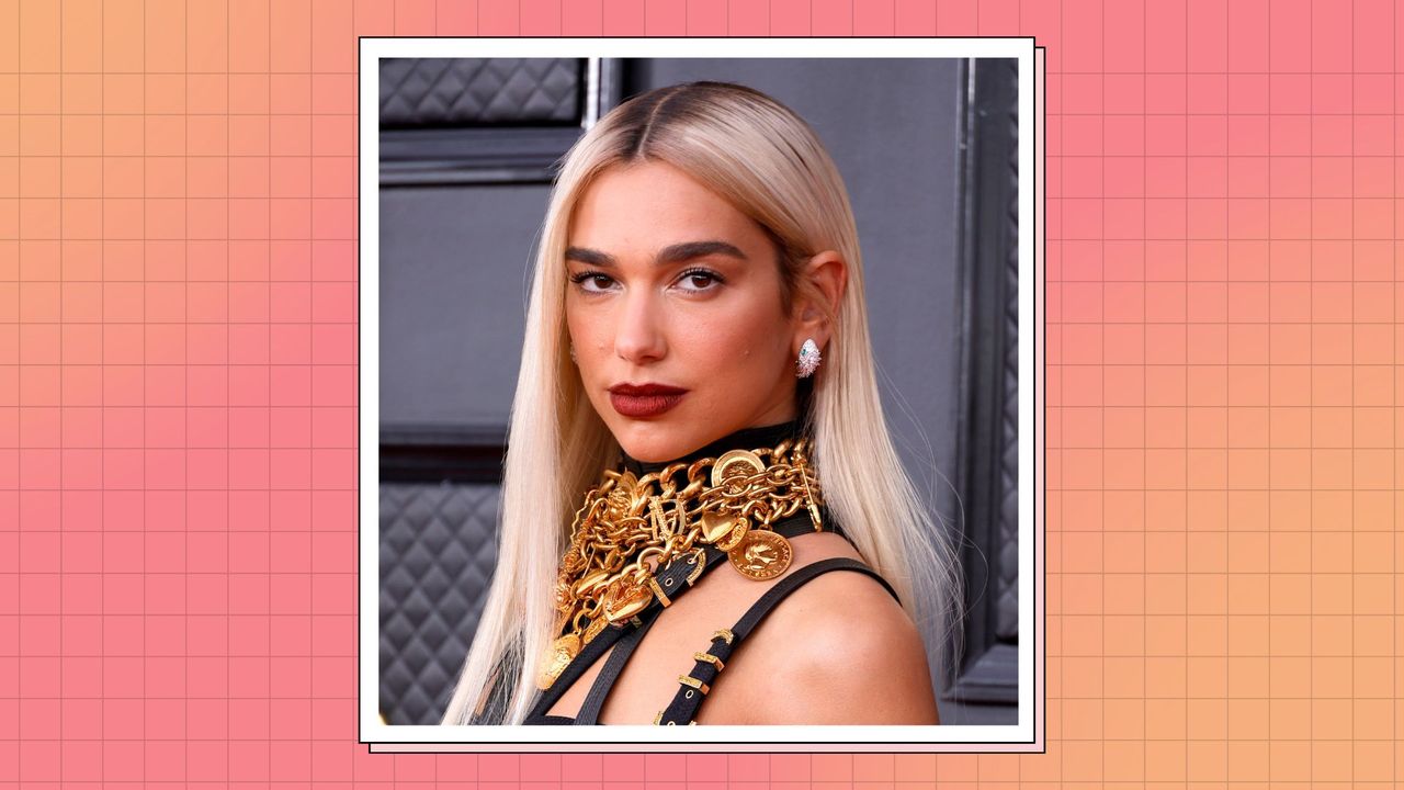 Dua Lipa with blonder hair, pictured wearing gold chain necklaces are her neck as she attends the 64th Annual GRAMMY Awards at MGM Grand Garden Arena on April 03, 2022 in Las Vegas, Nevada/ in a pink and orange check template