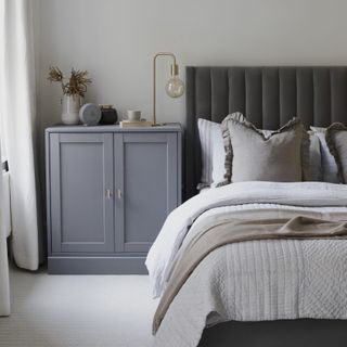 bedroom with bedside grey vanity