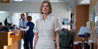 Rosamund Pike walking inside a care facility in I Care A Lot