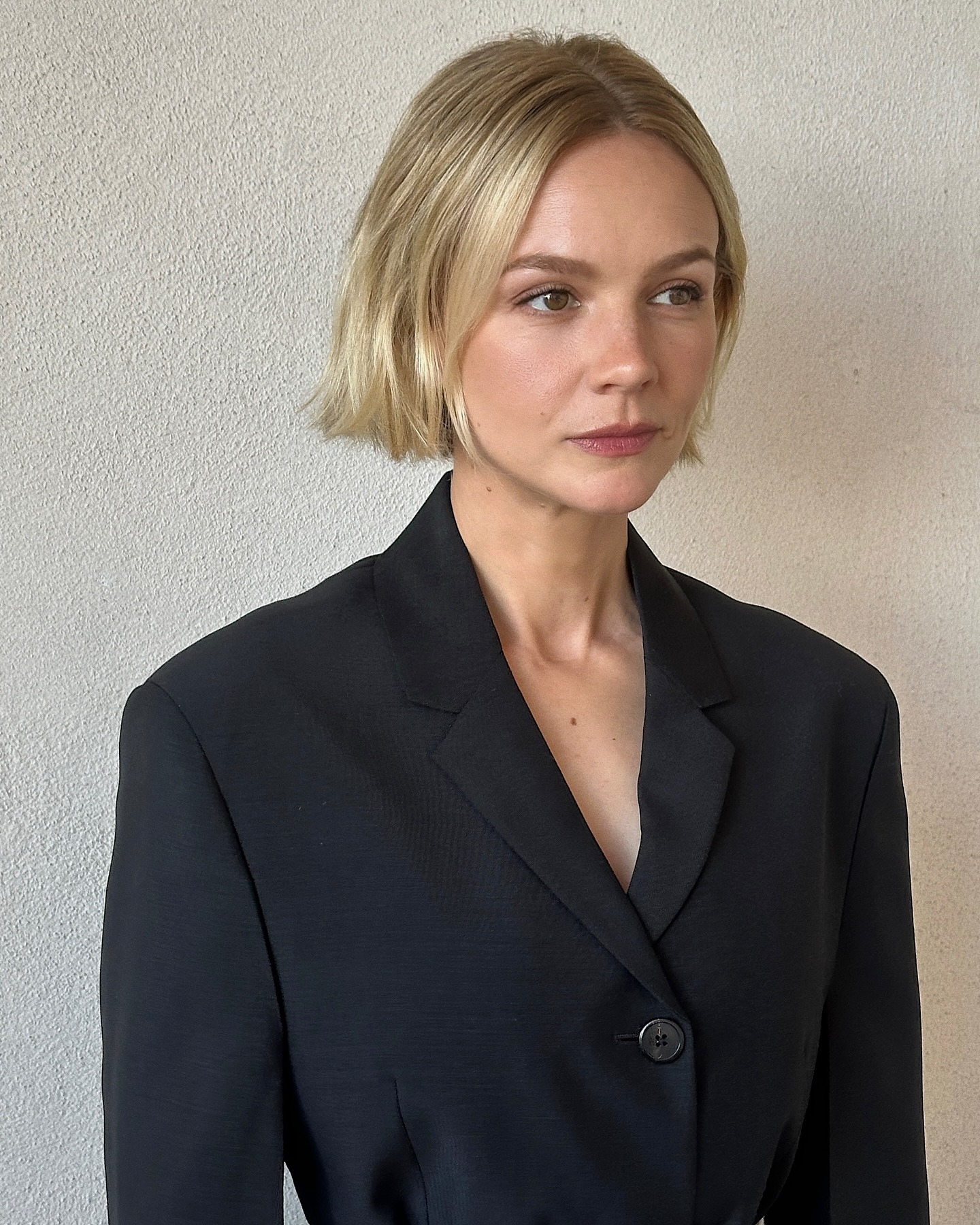 An image of Carey Mulligan at Prada's spring/summer 2025 show with a micro bob.