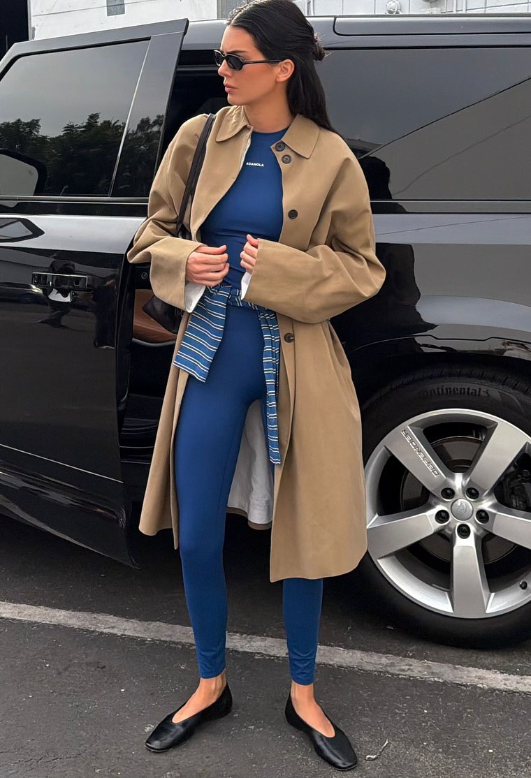 Kendall Jenner in blue leggings and black ballet flats.