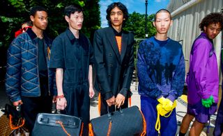 Louis Vuitton models with bright clothing and accessories