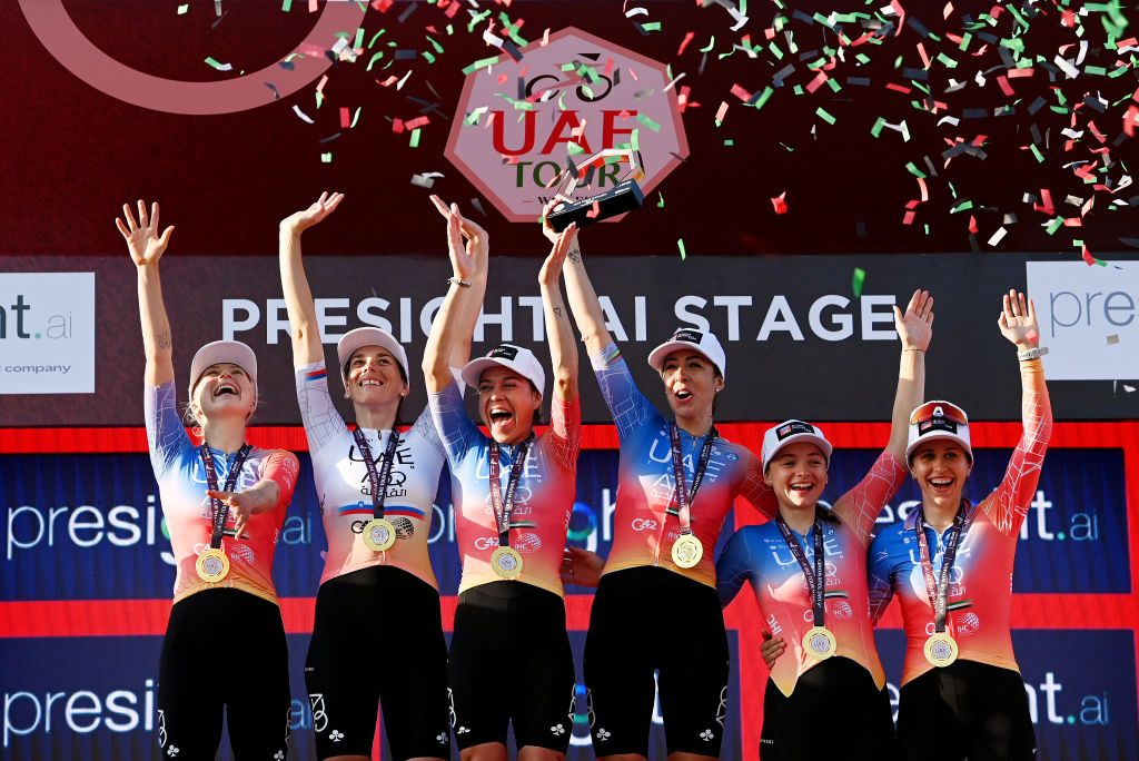 ABU DHABI UNITED ARAB EMIRATES FEBRUARY 12 Marta Bastianelli of Italy Eugenia Bujak of Slovenia Chiara Consonni of Italy Mikayla Harvey of New Zealand Silvia Persico of Italy Anna Trevisi of Italy and UAE Team ADQ celebrates at podium as Best team winners during the 1st UAE Tour Women 2023 Stage 4 a 119km stage from Fatima Bint Mubarak Ladies Sports Academy to Abu Dhabi Breakwater UAETourWomen UCIWWT on February 12 2023 in Abu Dhabi United Arab Emirates Photo by Tim de WaeleGetty Images
