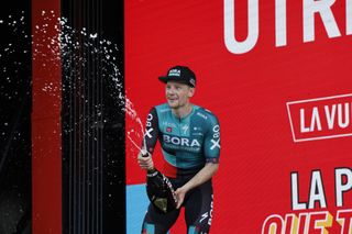 Sam Bennett on the podium as the winner of stage 2 at the Vuelta a Espana