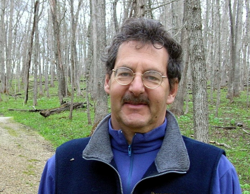 A headshot of David Sobel in the forest.