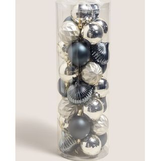 a clear tube of silver and blue baubles