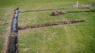 drainage trenches being dug in garden