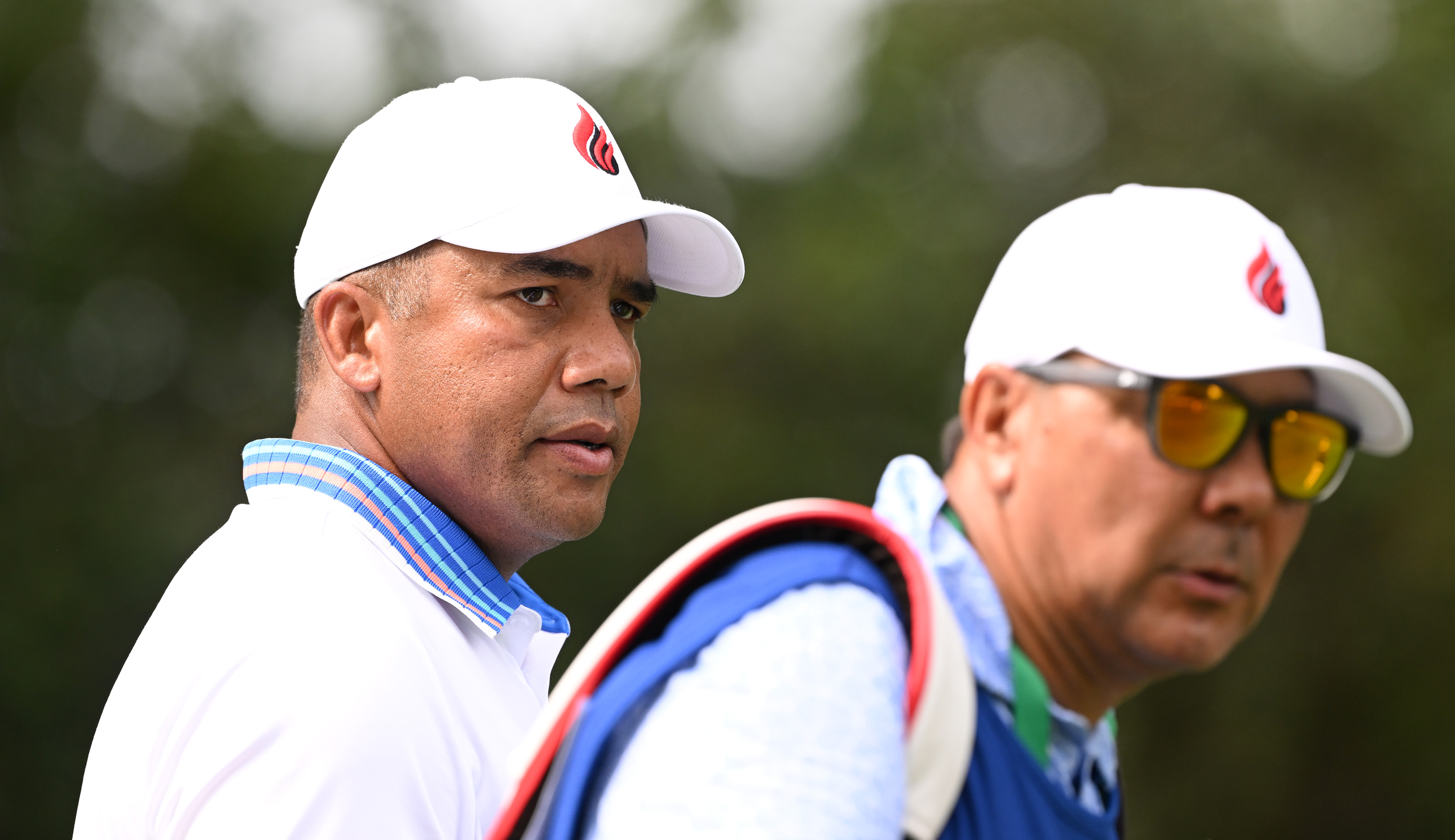 Jhonattan Vegas and his caddie look on