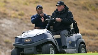 Tiger Woods is driven away from the course at the Genesis Invitational