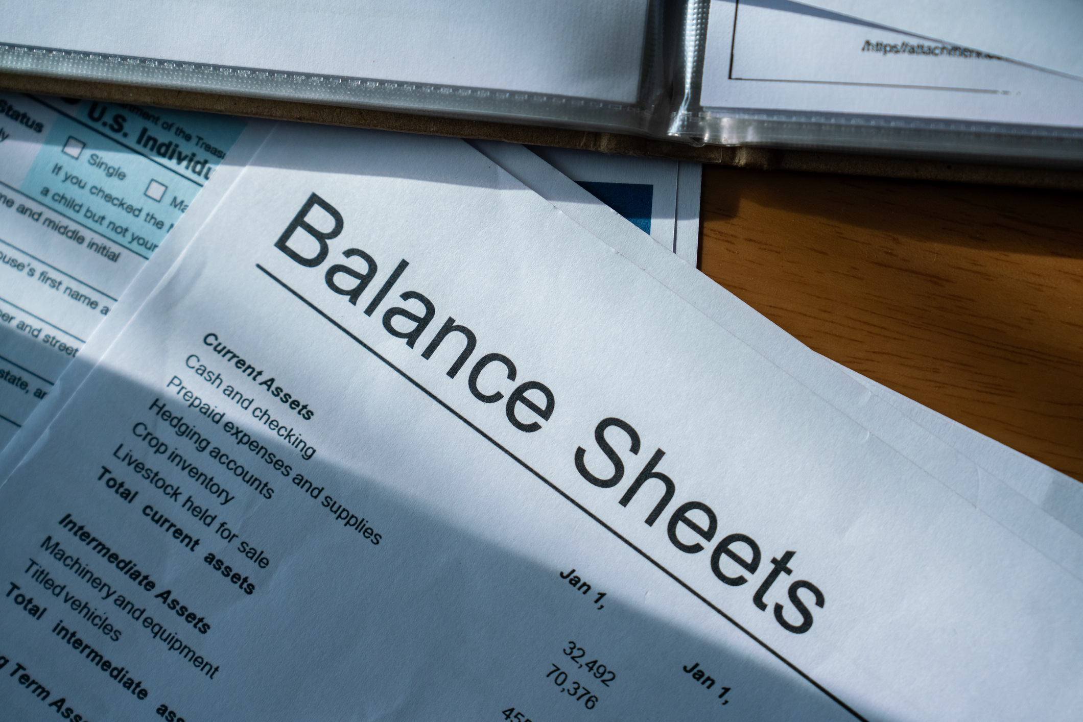 Detailed view of a balance sheet document on a desk, representing financial accounting, business analysis, and corporate finance management.