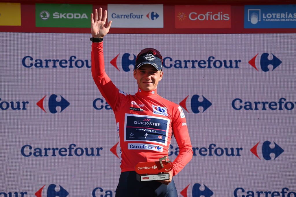 NAVACERRADA SPAIN SEPTEMBER 10 Remco Evenepoel of Belgium and Team QuickStep Alpha Vinyl Red Leader Jersey celebrates at podium during the 77th Tour of Spain 2022 Stage 20 a 181km stage from Moralzarzal to Puerto de Navacerrada 1851m LaVuelta22 WorldTour on September 10 2022 in Puerto de Navacerrada Spain Photo by Justin SetterfieldGetty Images
