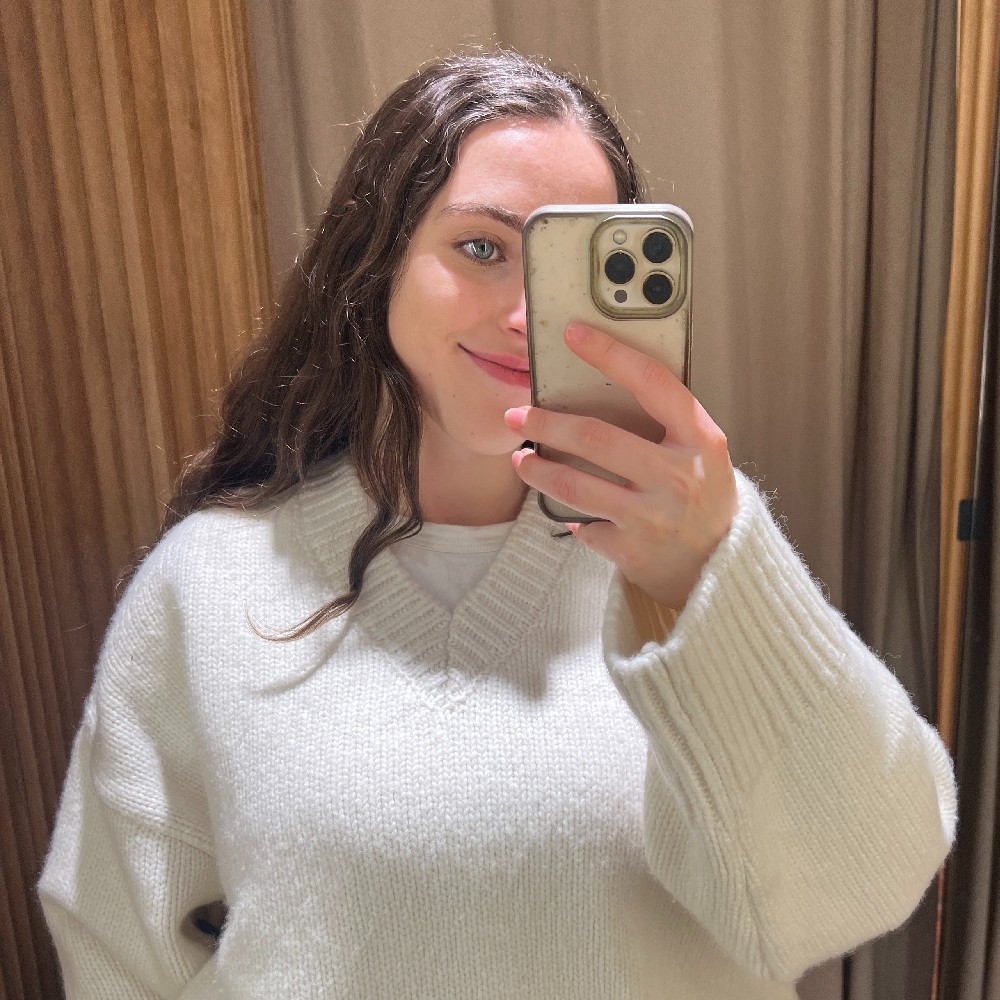 An image of Who What Wear's Ava Gilchrist wearing one of the best wool jumpers. 