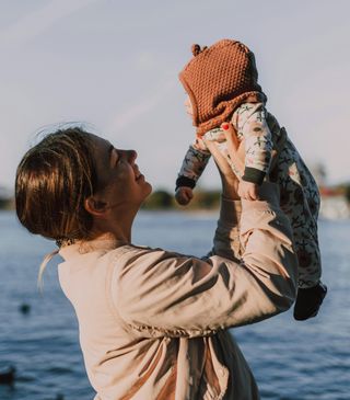 mother holding a baby