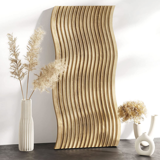 A wavy fluted serving board surrounded by dried florals