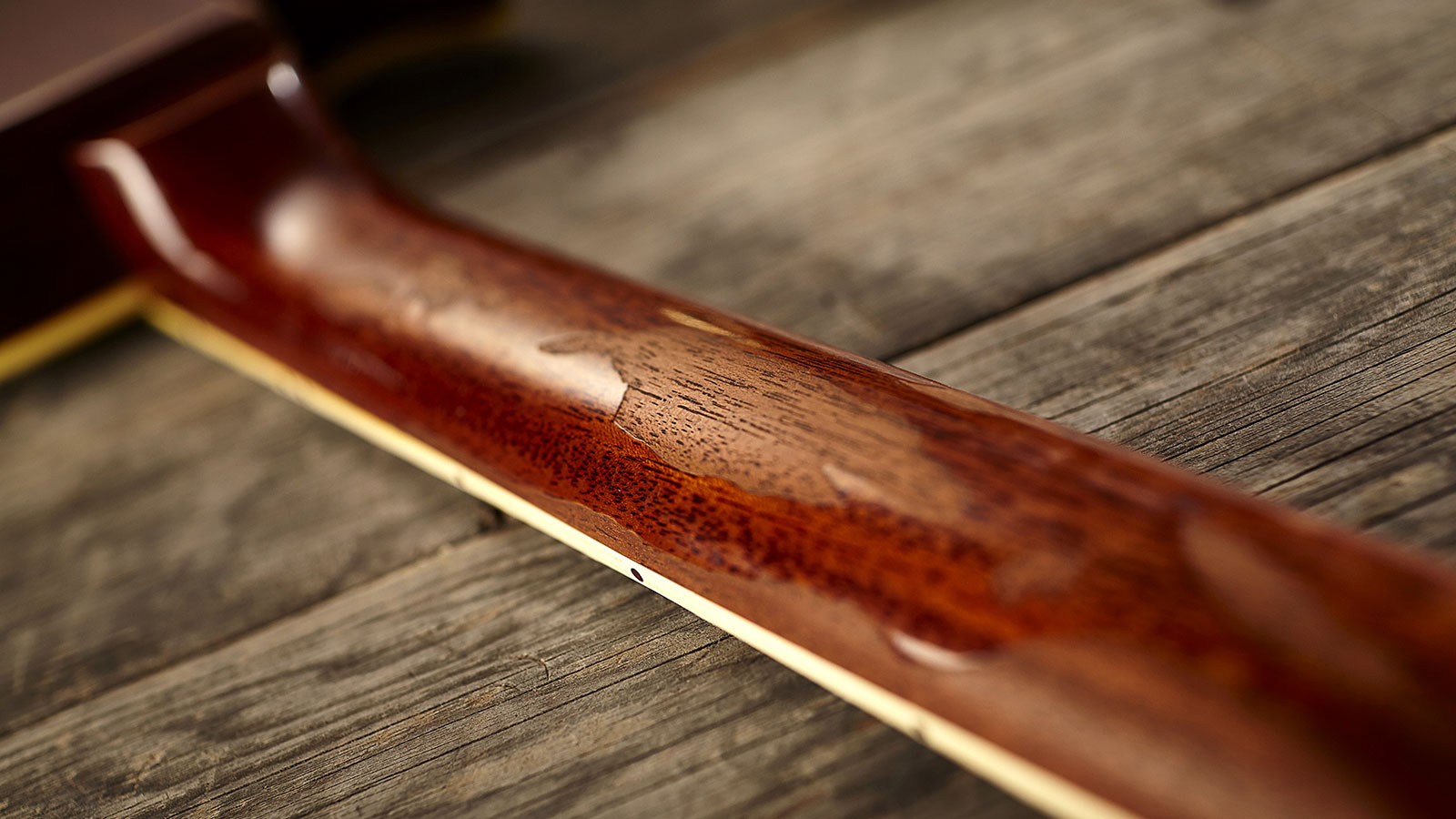 The neck is heavily relic'd with convincing player wear