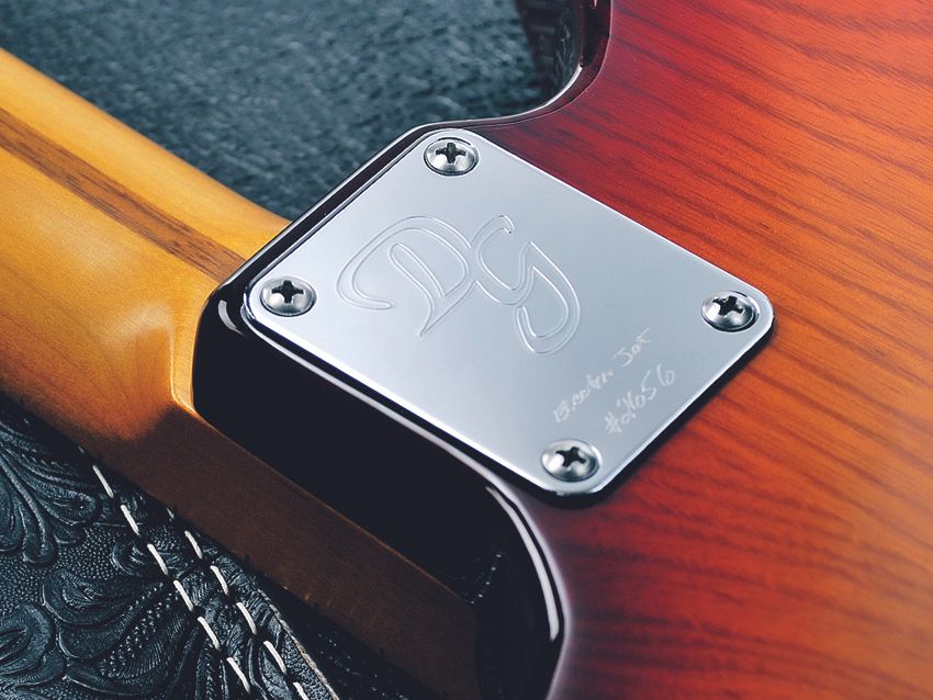 The four-bolt neck and chrome plate are very Fender-inspired.