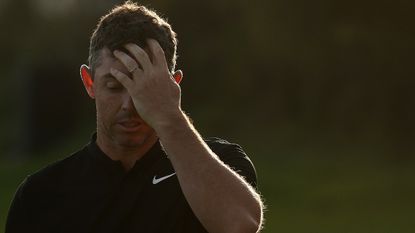 Rory McIlroy holds his face after a disappointing finish at the Genesis Invitational