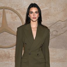 Kendall Jenner wearing an olive green suit