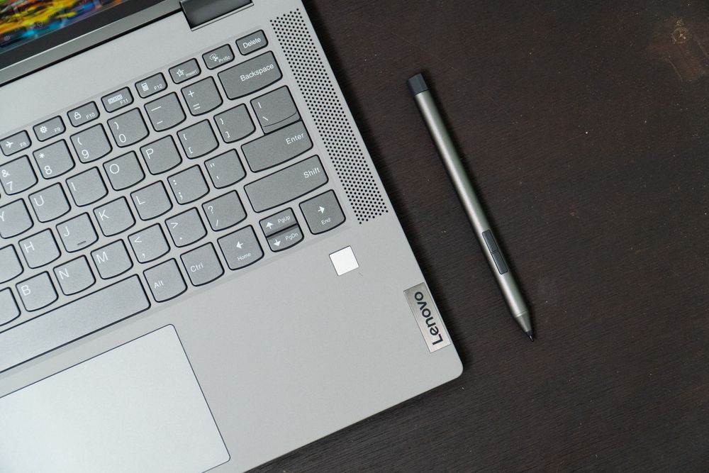 A Lenovo laptop&amp;#039;s keyboard and stylus pen