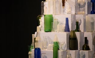 Display of the sculptural glass vessels he fashions from old broken bottles