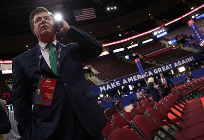 Paul Manafort takes a call at the Republican National Convention.