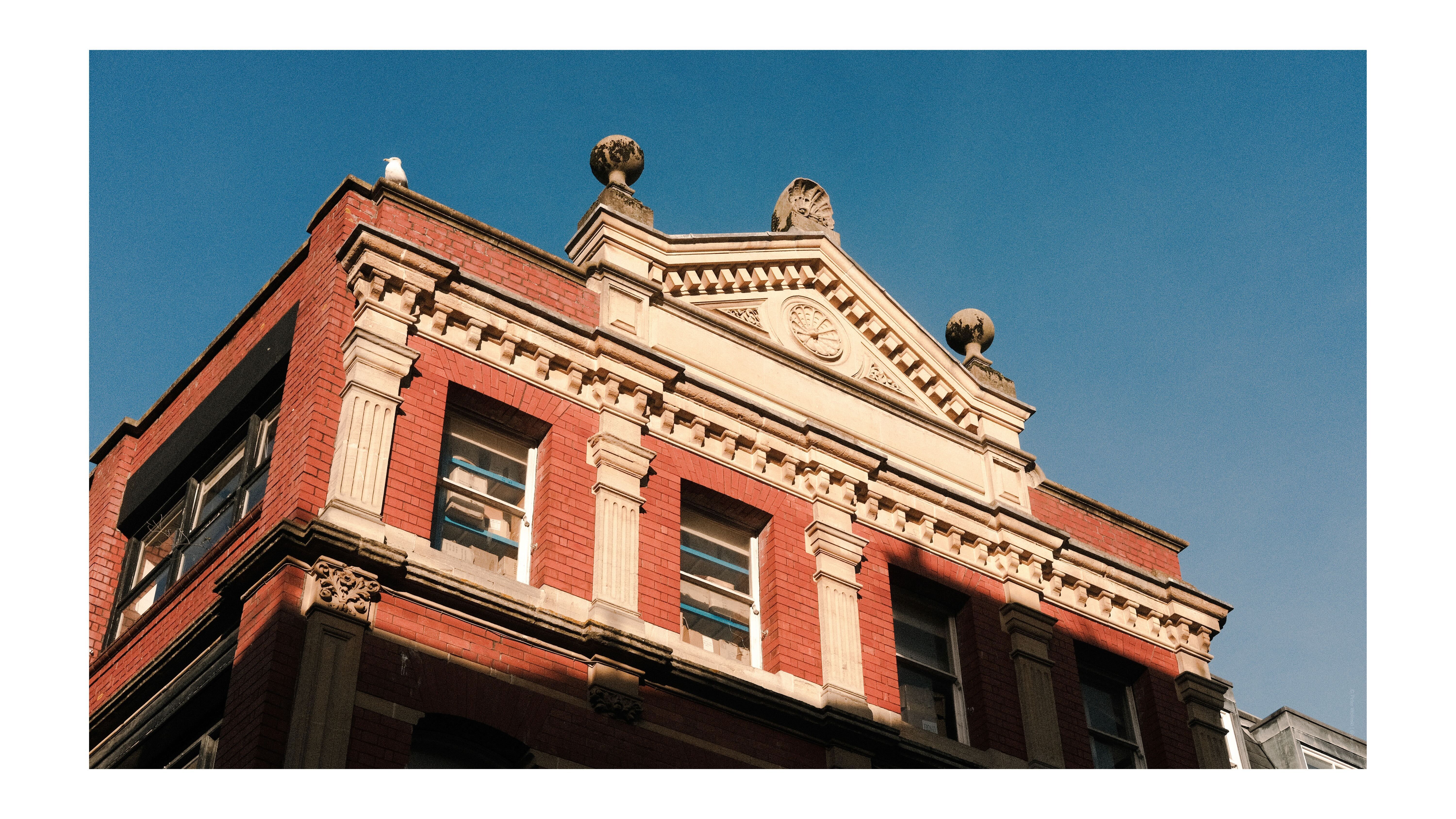 A photo of old buildings in Bristol, with blue skies, taken on the Fujifilm X-E4