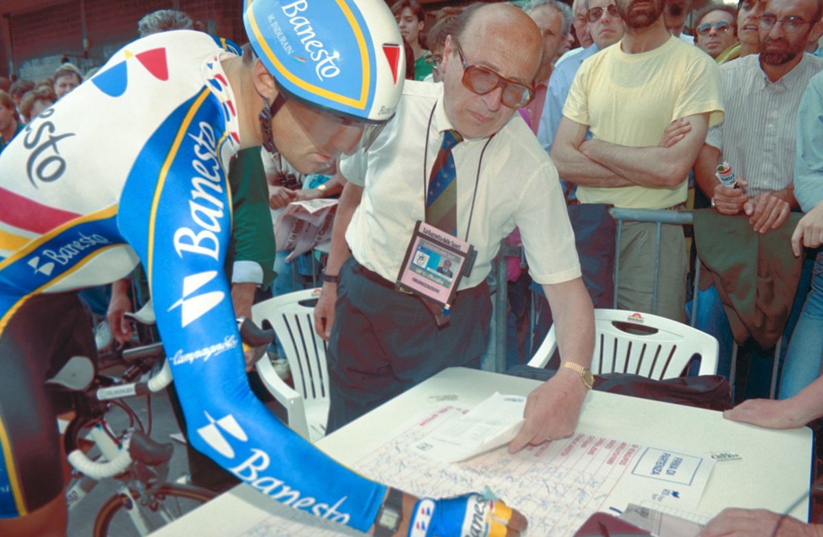 Tour de France champion Miguel Indurain signs on at the start of the 1992 Giro, where he'd win the second in a remarkable streak of five straight Grand Tours