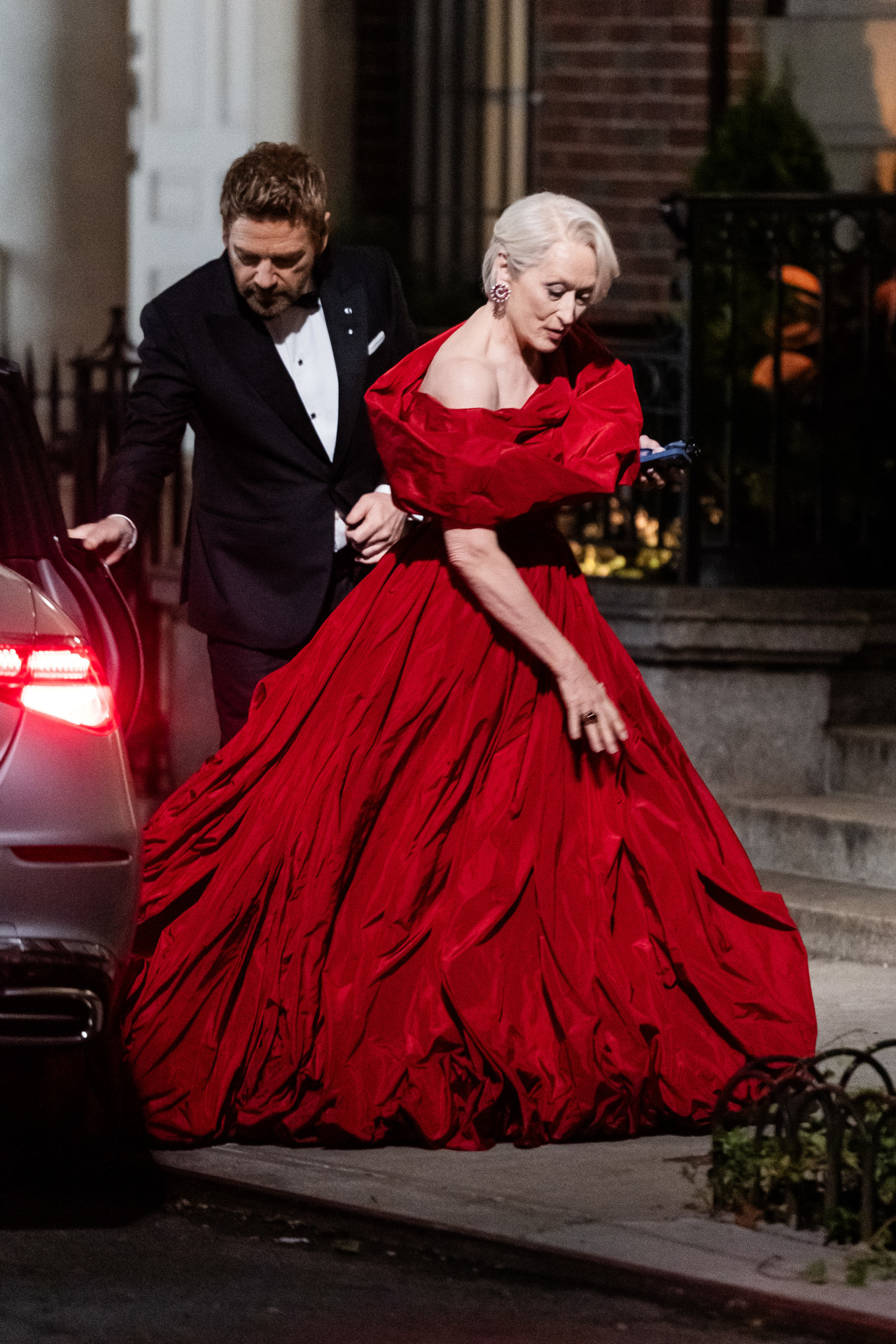 Kenneth Branagh (L) and Meryl Streep are seen filming "The Devil Wears Prada 2" in the Upper East Side on August 15, 2025 in New York City. Streep is wearing a big red ballgown.