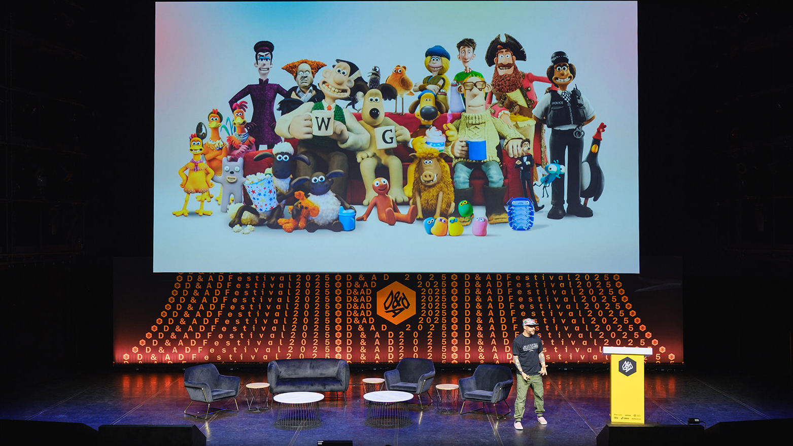 Gavin Strange on stage at D&AD Festival with Wallace and Gromit image behind him