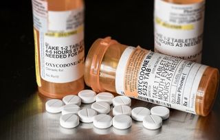 Prescription opioid pills and bottles.