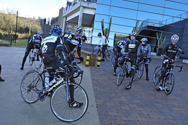 The riders gather outside the team's hotel in Girona